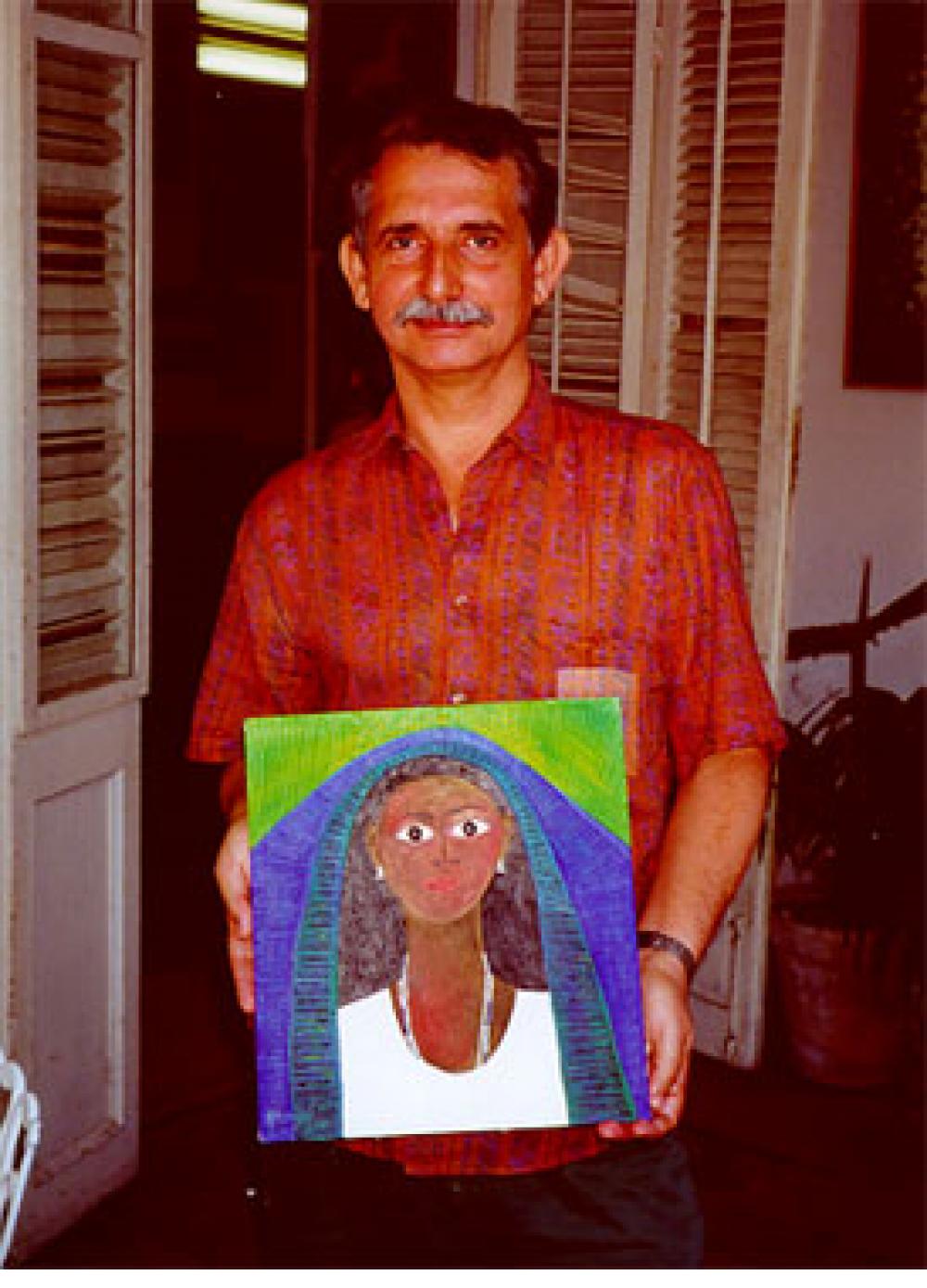 José Garcia Montebravo with his painting "Imagen en Azul (Yemaya)", in his Cienfuegos studio, 2000.