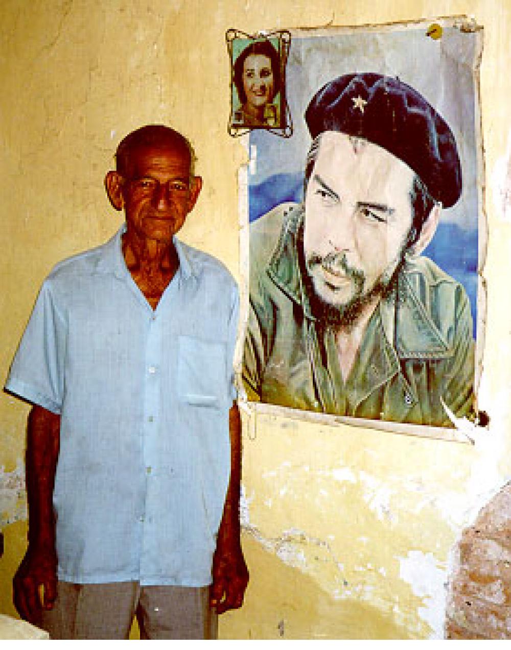 Veteran of the revolution - in Trinidad, Cuba, with pictures of his wife and Ché.