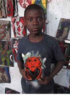 Artist Apali with one of his works, February, 2014.