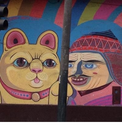 including a cat and a man in a chullo hat. including a cat and a man in a chullo hat.