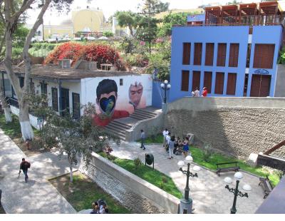 Mural by Jade Rivera dramatically situated on a stairway into the barranco of the Barranco neighborhood.