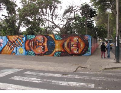 A wall of faces in Barranco.