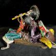 Two Musicians on a Log - calavera sculpture