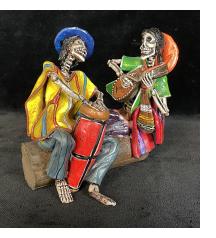 Two Musicians on a Log - calavera sculpture