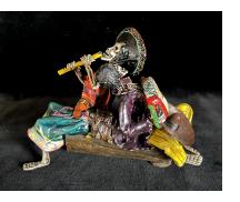 Two Musicians on a Log - calavera sculpture