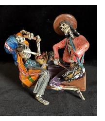 Two Musicians on a Log - calavera sculpture