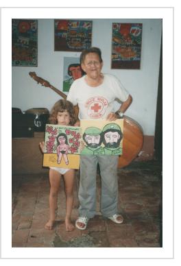 Abel Perez Mainegra and granddaughter with painting of Fidel and Che. Trinidad, Cubam, August 2001 (Photograph © Anthony Hart Fisher 2001).