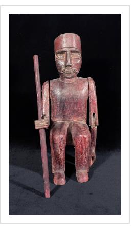 Seated Ajitz figure