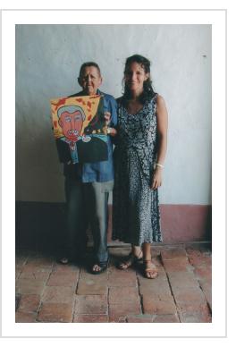 Abel Perez Mainegra (with daughter) and painting of George Bush. Trinidad, November, 2001  (Photograph © Anthony Hart Fisher 2001). 