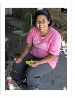 Antonia Carrillo painting a moose antler. Arrazola, Oaxaca, 2010. (Photograph © Anthony Hart Fisher, 2010)