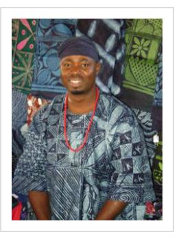 Nigerian indigo artist Gasali Adeyemo. Yoruba adire cloth shown. Santa Fe, NM, 2009. (photo courtesy of the artist).