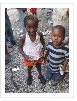 "Timoun". Two of the children of the Gran Rue, November, 2009. (Photograph © Anthony Hart Fisher 2009).