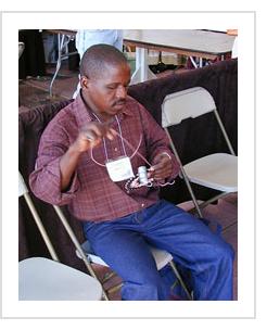 South African Imbenge basket artist Vincent Sithole demonstrates his art on a "hardwire basket" at the International Folk Art Market in Santa Fe, NM, July 2004.