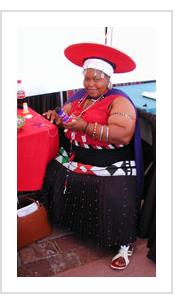 Traditional Zulu doll artist Lobolile Ximba demonstrates her art at the International Folk Art Market in Santa Fe, NM, July 2004. ( Photograph © Anthony Hart Fisher 2004)