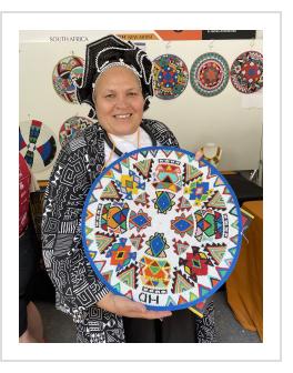 Master artist Hlengiwe Dube at work at the International Folk Art Market.  Santa Fe, NM, July 2025 ( Photograph © Anthony Hart Fisher 2025) 