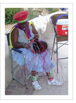 South African Imbenge basket artist Jaheni Mkhize demonstrates "soft basket" construction in Santa Fe, July 2005.