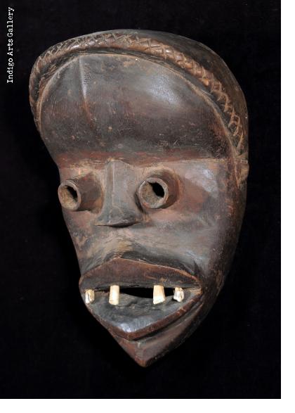 Dan Guere mask with animal teeth