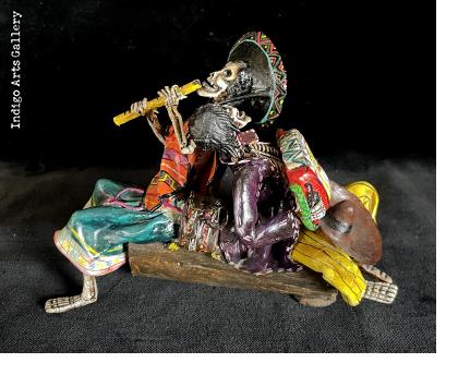 Two Musicians on a Log - calavera sculpture