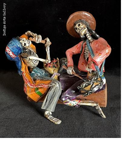 Two Musicians on a Log - calavera sculpture