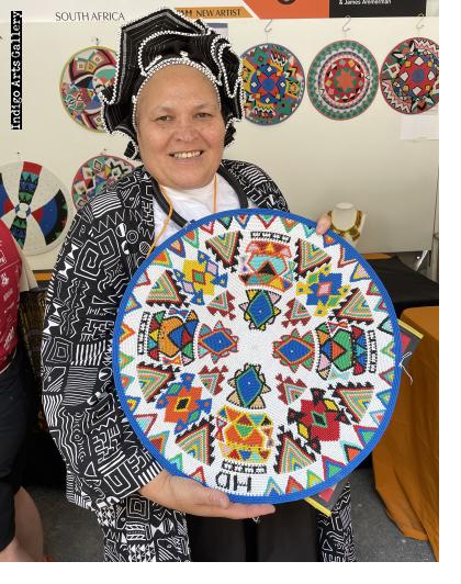 Master artist Hlengiwe Dube at work at the International Folk Art Market.  Santa Fe, NM, July 2025 ( Photograph © Anthony Hart Fisher 2025) 